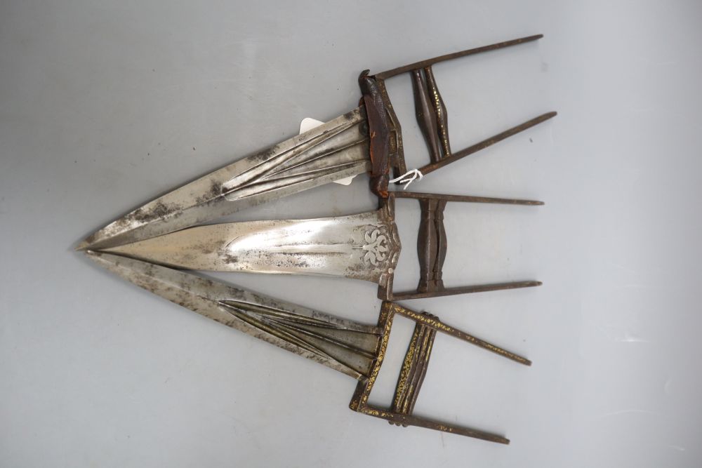 Three Mughal Indian katars in their sheaths